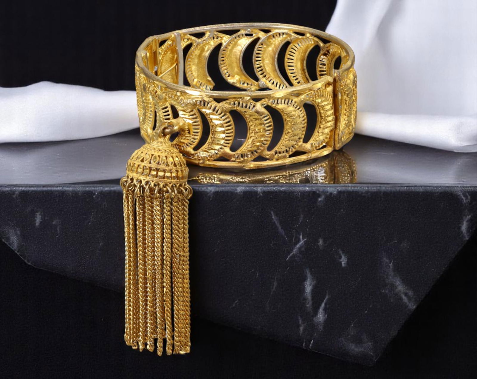 VINTAGE ROMANTIC ERA: Bracelet - Crescent Motif, Filigree Goldtone with Tassel Accent (6 cm): This expressive vintage bracelet captures the charm of romantic-era design through its intricate openwork crescent motif and filigree textures, rendered in a rich goldtone finish. A detailed chain tas
