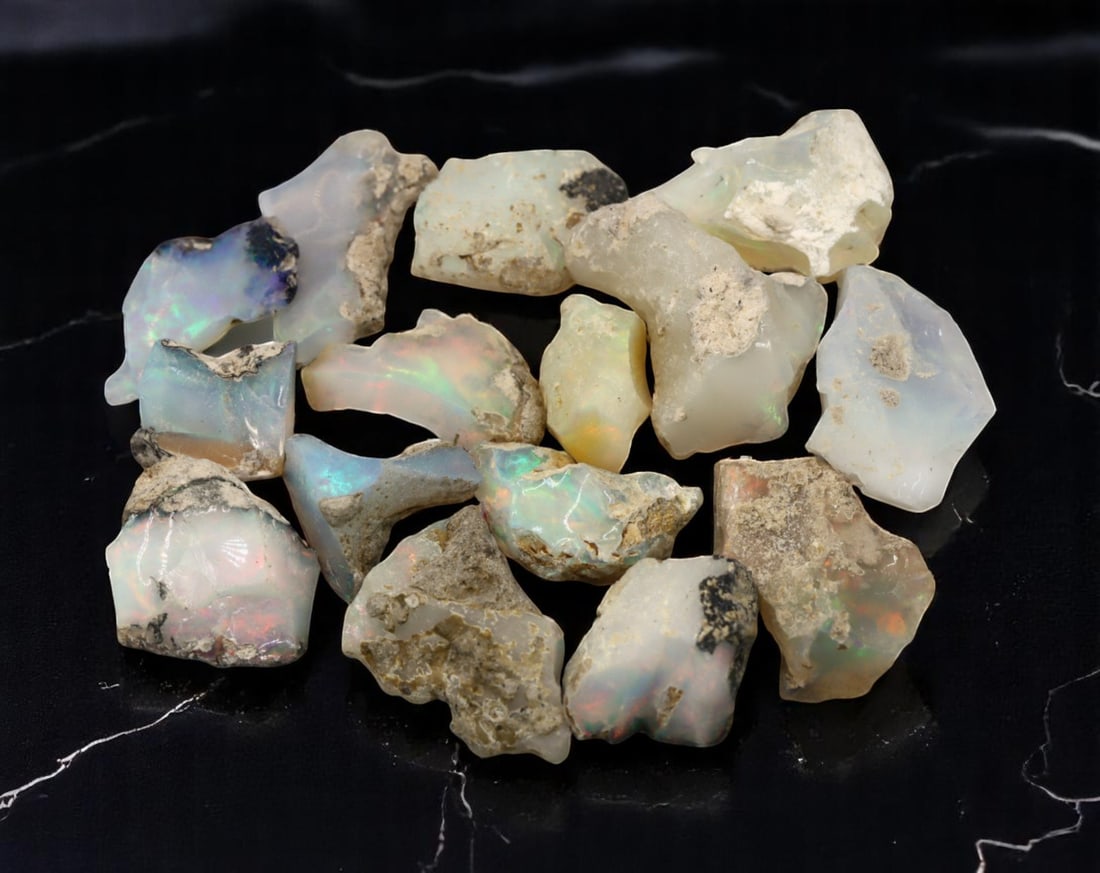 GEM LOT: Ethiopian Welo Opal Rough - Iridescent Play-of-Color in Matrix, Mixed Forms (10g): An estate-sourced parcel of natural Ethiopian Welo Opal rough, totaling 11 grams, this lot features raw, matrix-hosted specimens with vibrant play-of-color across milky, translucent, and honey-toned b