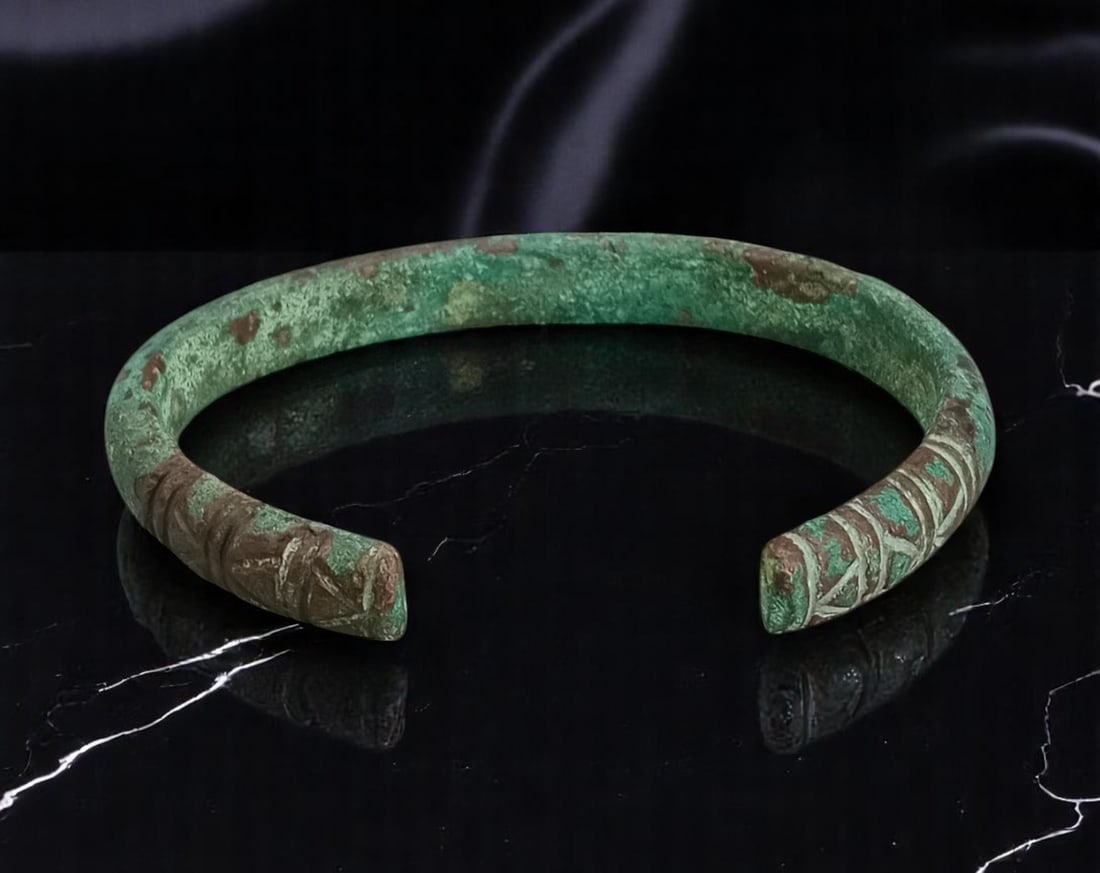 ANTIQUE: Ancient Bronze Cuff - Tribal Engraved Motif, Verdigris Patina, 9.5cm, 104g: A beautifully aged artifact, this ancient bronze cuff bracelet features incised tribal-style linear engravings along one terminal, possibly symbolic or totemic in nature. The open-ended form allows fo