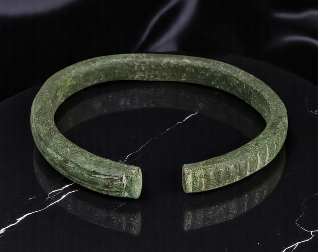 ANTIQUE: Ancient Bronze Cuff - Archaic Form, Timeworn Patina, 10cm, 159g: An evocative artifact from antiquity, this solid bronze cuff bracelet exhibits an archaic form with a squared, open-ended design and richly weathered surface. The bracelet weighs 159g and spans approx