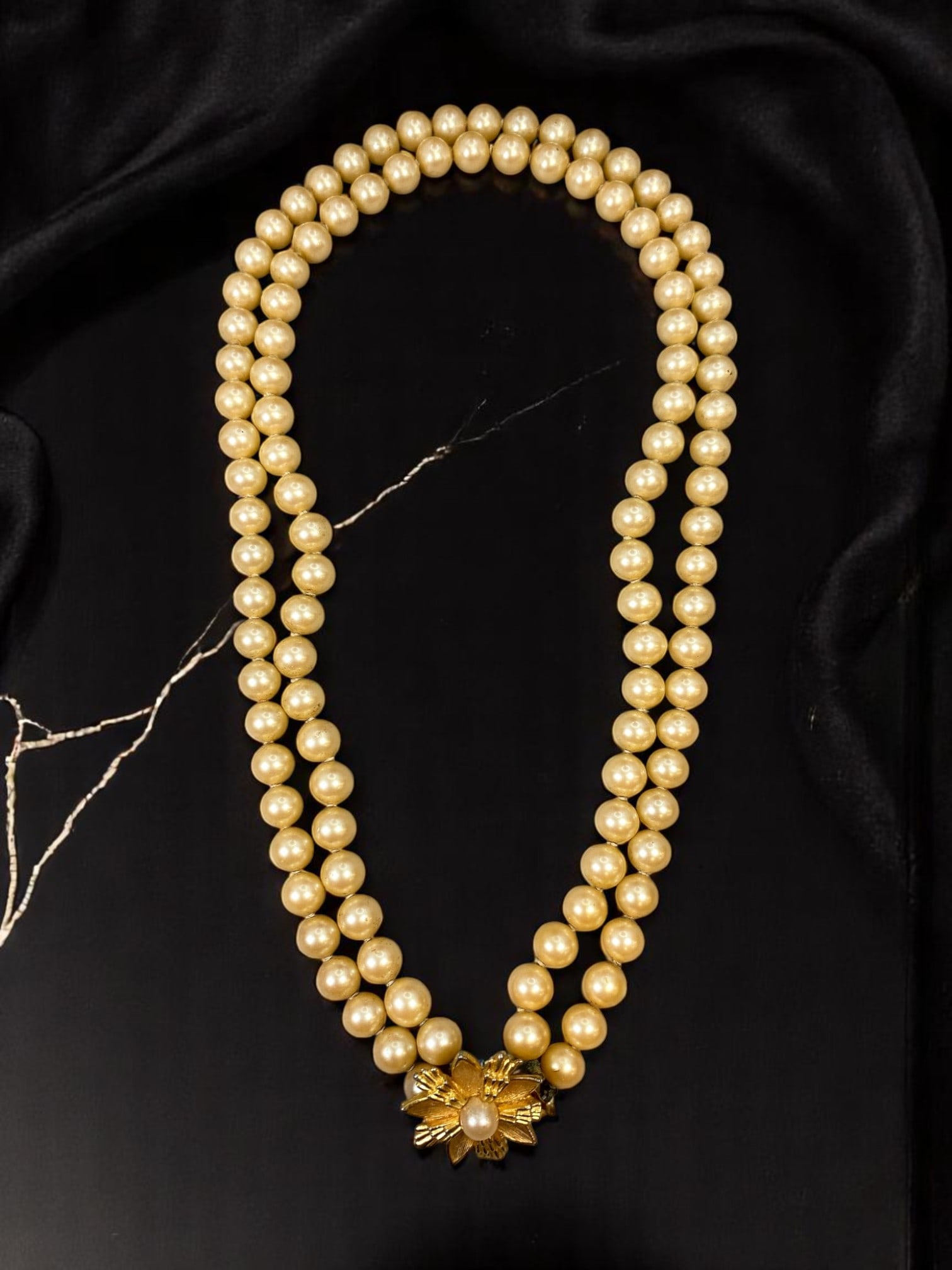 VINTAGE ESTATE: Double Strand Necklace - Pearl-Like Beads, Floral Clasp Accent 44cm: This sophisticated vintage estate necklace offers timeless elegance with its classic double strand of softly lustrous pearl-like beads. The strands are beautifully anchored by a sculptural goldtone fl