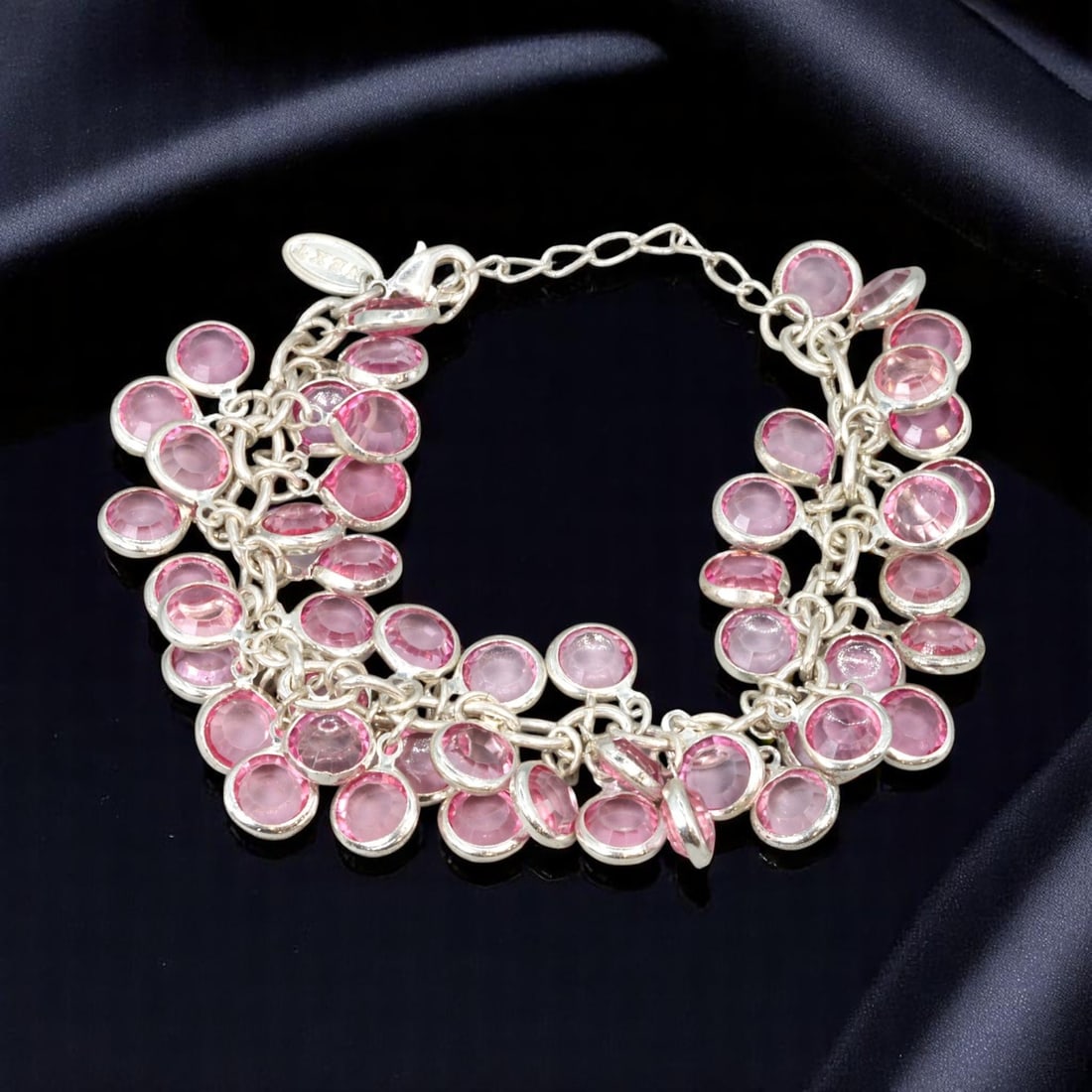 Bracelet - Vibrant Pink Charm Discs, Silvertone, Brand NEXT (20cm): A vibrant and playful designer bracelet from NEXT, featuring a cascade of bezel-set, pink-tone disc charms suspended from a bold silvertone link chain. The layered effect of the translucent pink eleme