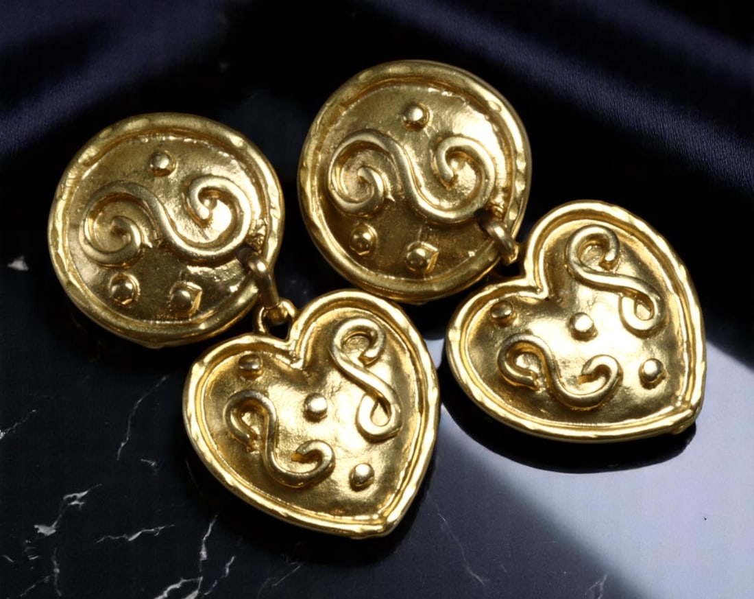Clip Earrings - Sculptural Medallion & Heart Forms, Rich Goldtone (5.5 x 2.5 cm, Stamped Italy): A striking pair of Retro Modern era clip earrings, this Italian-stamped duo features bold sculptural design in richly burnished goldtone. The earrings combine textured medallion tops with stylized hea