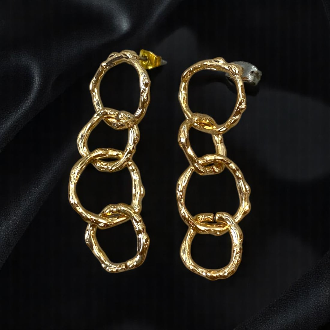 ITALY: Modernist Elegance - Textured Linked Circle Earrings, 4.2cm: Capturing the bold essence of modern Italian design, these 4.2cm earrings feature a cascading sequence of irregularly textured interlocking circles. The radiant gold-tone finish adds a contemporary ed