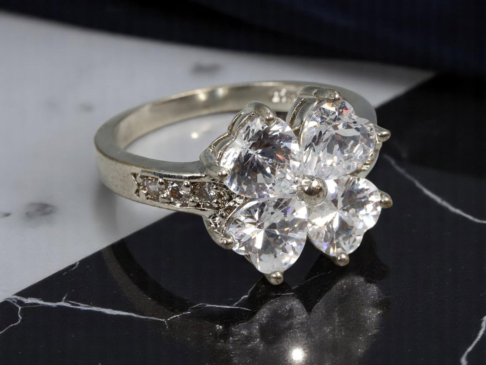 Cluster Ring - Brilliant-Cut Clear Stones in 18KGP Setting, 6.75 US: Estate Jewelry with dazzling clarity, this size 6.75 cluster ring features five faceted clear stones arranged in a floral-like burst, each prong-set to accentuate lightplay and dimension. The shoulder