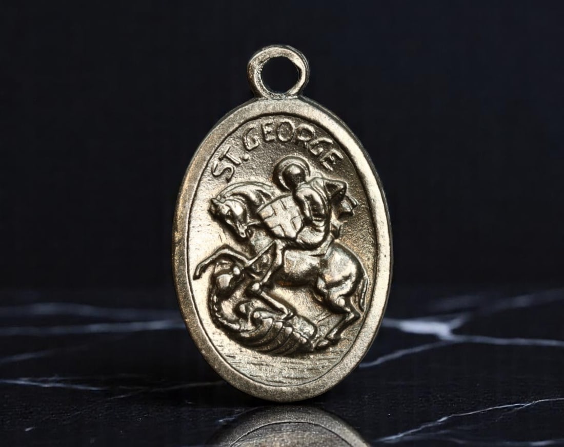 ITALY: Chivalric Valor & Mater Dolorosa - St. George Devotional Medal, ca. 20th Century, 25mm: This dual-sided devotional medal powerfully unites themes of military valor and maternal sorrow. On one side, St. George, the archetype of Christian knighthood, is shown triumphantly slaying the drago