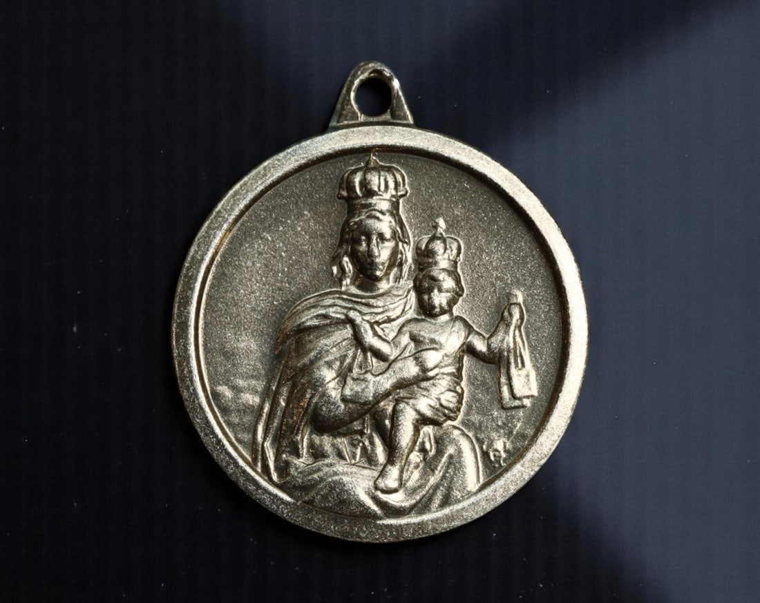 ITALY: Sacred Heart and Madonna of Mount Carmel - Dual Devotional Medal, c.1950s, 20mm: This finely detailed devotional medal encapsulates two foundational pillars of Catholic piety in mid-20th-century Italy. One side features Christ with His exposed Sacred Heart radiating divine mercy-a