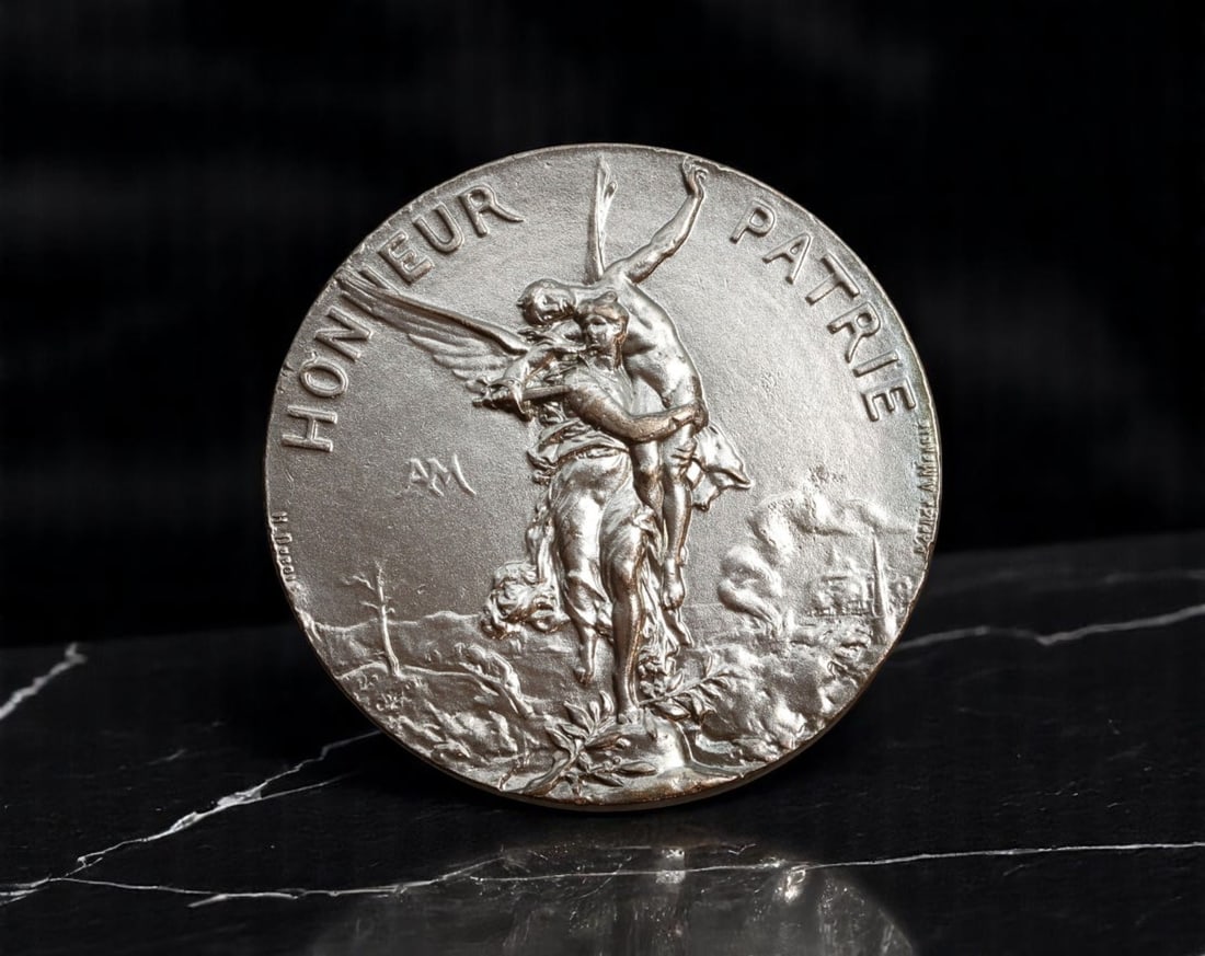 FRANCE: Patriot's Reward - Union des Societes de Tir Silver Shooting Medal, 1886, 44mm: Issued by the Union des Societes de Tir de France, this evocative silvered medal encapsulates the martial idealism of the French Third Republic. The obverse features a dramatic allegory of "Honneur et