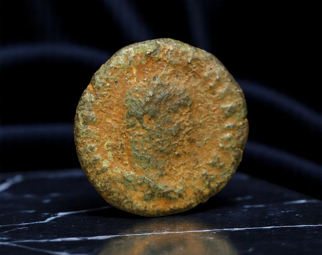 ROMAN EMPIRE: Ancient AE Coin Bronze Issue, 25mm: Issued during one of the most transformative epochs of the Roman Empire, this bronze coin embodies the endurance and adaptability of Roman statecraft across centuries. Its compact flan and timeworn su