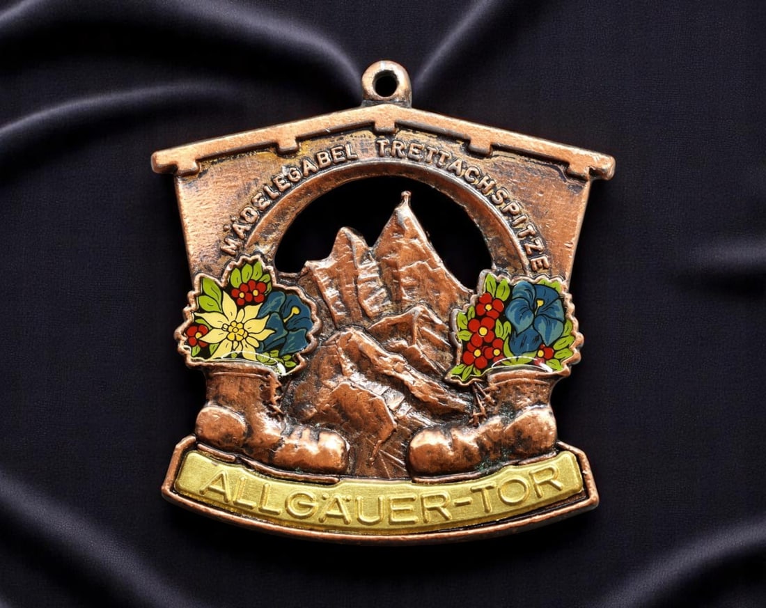 GERMANY: Alpine Heritage - Allgauer-Tor Mountain Trekking Plaque, ca. 1960s, 65mm: Evocative of postwar alpine tourism and regional pride, this large-format copper-tone trekking plaque celebrates the iconic Allgauer-Tor-a gateway to the rugged beauty of the Allgau Alps. Flanked by v