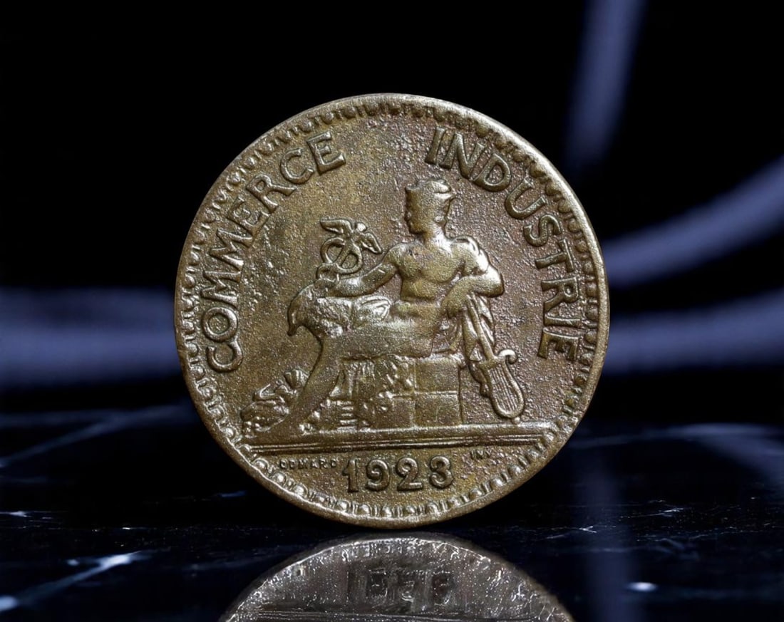 FRANCE: Commerce and Industry Allegory - 50 Centimes Token Coin, 1923, 18mm: Issued during the volatile interwar period, this 1923 token-style 50 Centimes coin celebrates the pillars of French recovery: commerce and industry. The obverse presents a neoclassical figure of Mercu