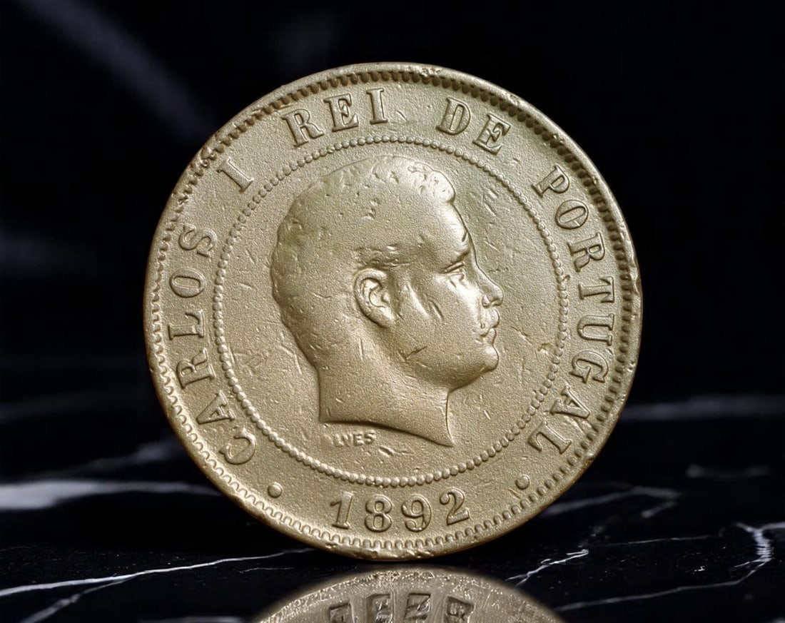 PORTUGAL: King Carlos I - Regal Stability 20 Reis Coin, 1892, 30mm: Issued during the twilight of Portugal's monarchy, this 1892 20 Reis coin reflects the dignity and continuity King Carlos I sought to embody. His youthful portrait, styled in classical restraint, proj