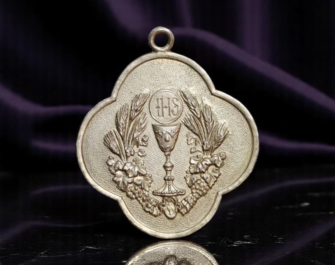 EUROPE: Holy Eucharist - First Communion Devotional Medal Coin, ND, 28mm: This quatrefoil-shaped devotional medal celebrates the solemn rite of First Communion, with the central motif presenting the Eucharistic chalice surmounted by the sacred monogram "IHS"-a Christogram d