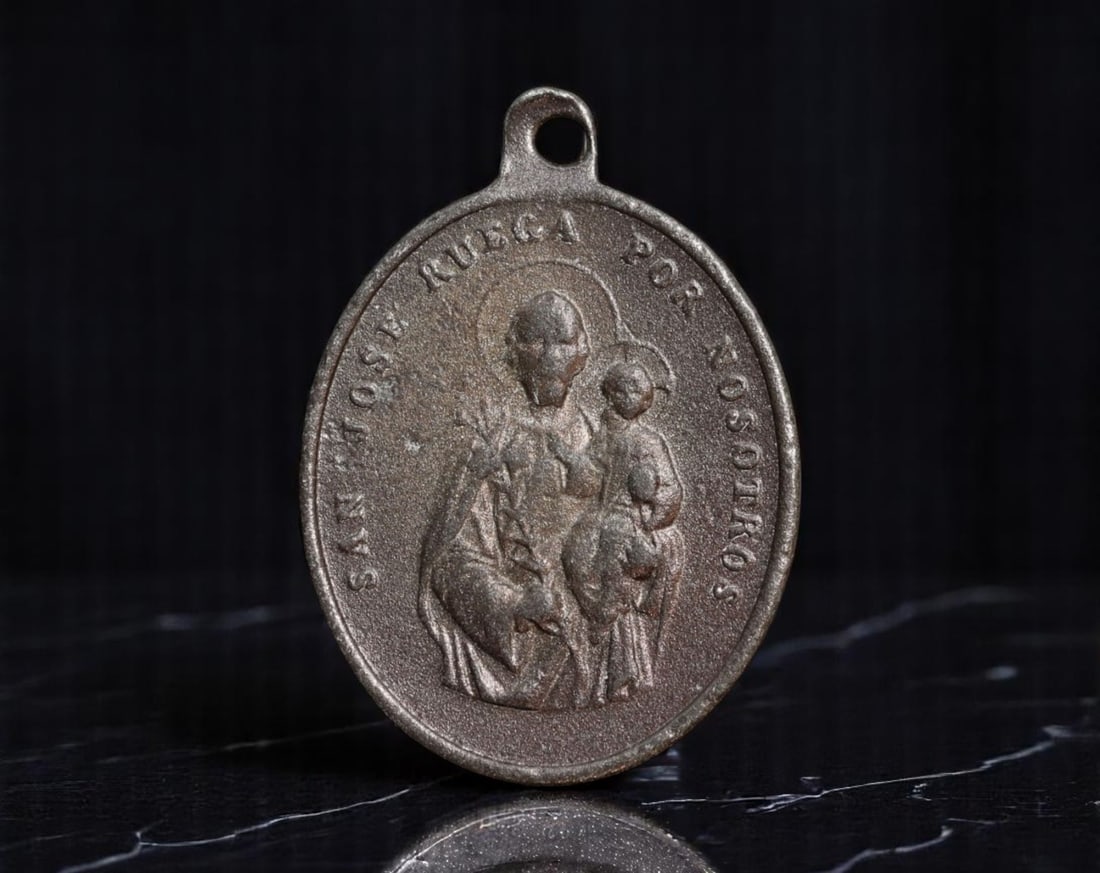 SPAIN: Dual Patronage - St. Joseph & St. Anthony Devotional Medal, c.1930s, 28mm: This Spanish devotional medal honors two of the most beloved intercessors in Catholic tradition: St. Joseph and St. Anthony of Padua. Cast in bronze-toned alloy with a soft matte finish, one side depi
