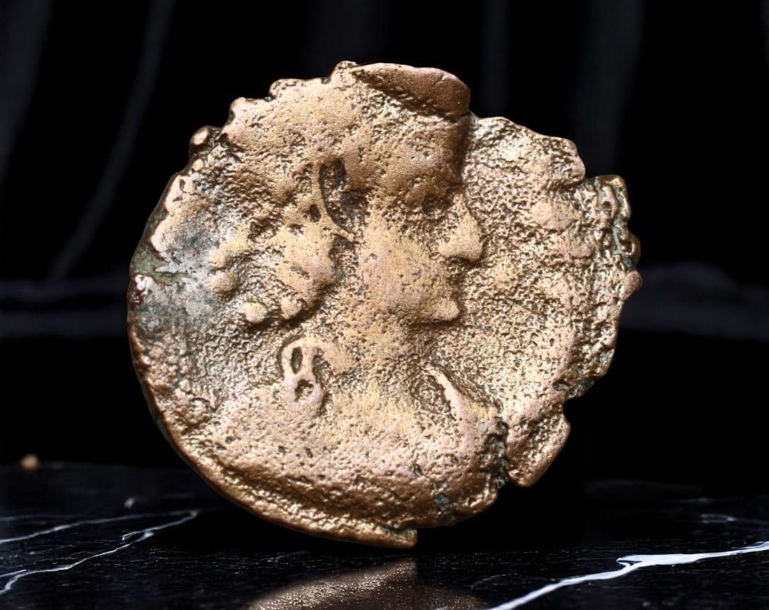 ROMAN EMPIRE: Ancient AE Coin Bronze Issue, 18mm: Issued during one of the most transformative epochs of the Roman Empire, this bronze coin embodies the endurance and adaptability of Roman statecraft across centuries. Its compact flan and timeworn su