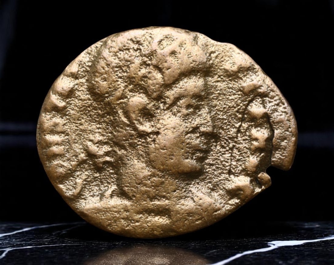 ROMAN EMPIRE: Ancient AE Coin Bronze Issue, 16mm: Issued during one of the most transformative epochs of the Roman Empire, this bronze coin embodies the endurance and adaptability of Roman statecraft across centuries. Its compact flan and timeworn su