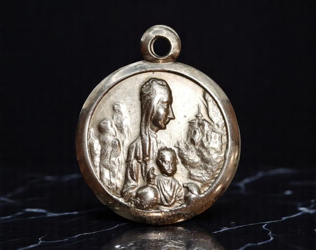 FRANCE: Marian Pilgrimage - Madonna and Child with Visionaries Religious Medal, ca. 1930s, 17mm: Rendered in serene relief, this petite French devotional medal features a quietly reverent depiction of the Virgin Mary cradling the Christ Child, with a pair of kneeling visionaries at her side-likel