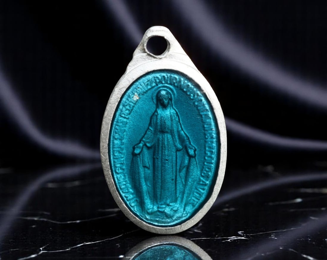 FRANCE: Marian Intercession - Blue Enamel Miraculous Medal "France" Issue, c.20th Century, 15mm: This classic 15mm Miraculous Medal presents the Virgin Mary in radiant blue enamel, arms outstretched in a gesture of grace and intercession. The surrounding inscription reads "O Mary conceived withou