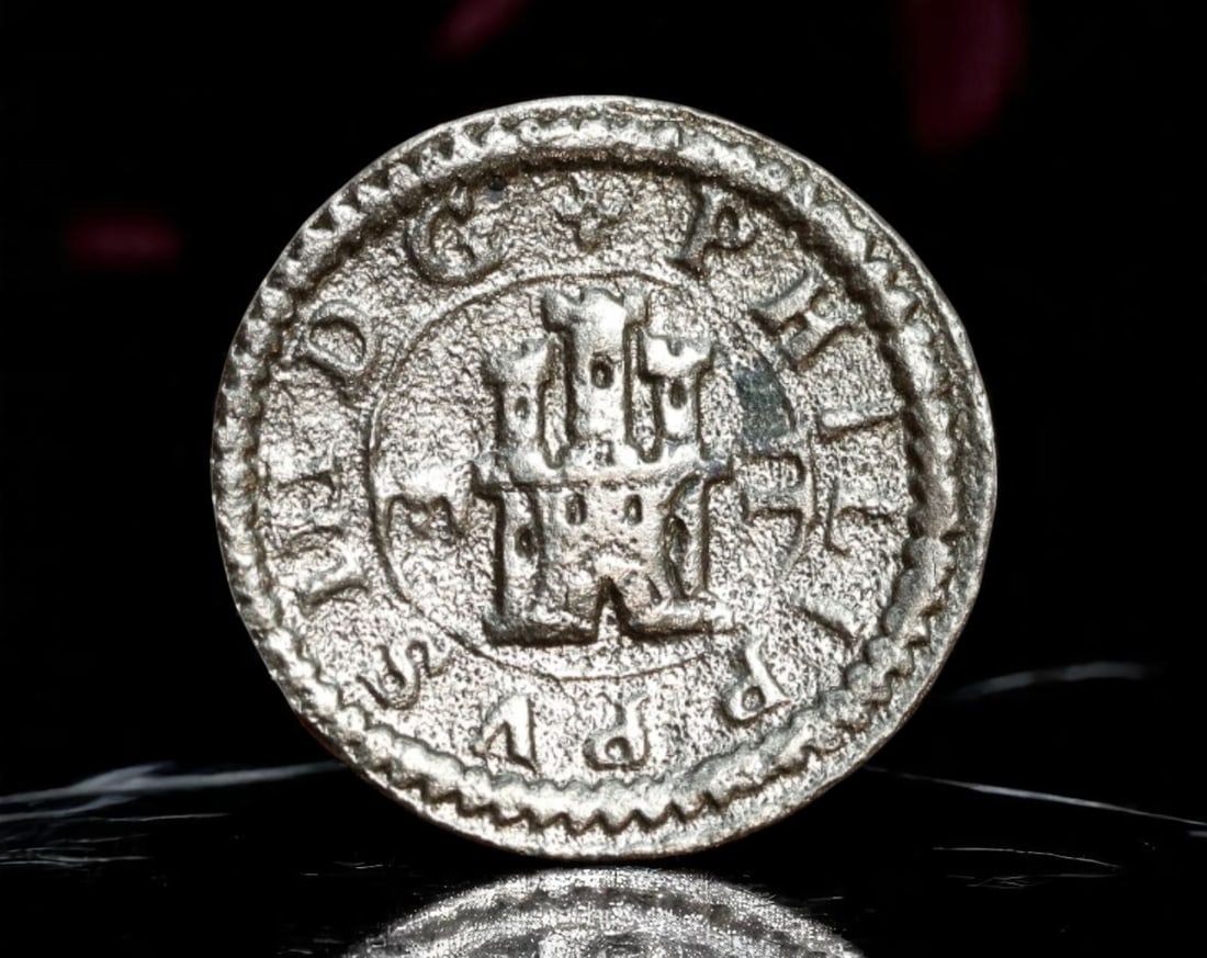 SPAIN: Philip III - Copper 2 Maravedis Coin, 1607 Segovia Ingenio Mint (17mm): Struck at the famed Segovia Ingenio mint in 1607 under Philip III, this copper 2 Maravedis coin measures 17mm and features the hallmark mechanical precision of one of Spain's earliest roller press min