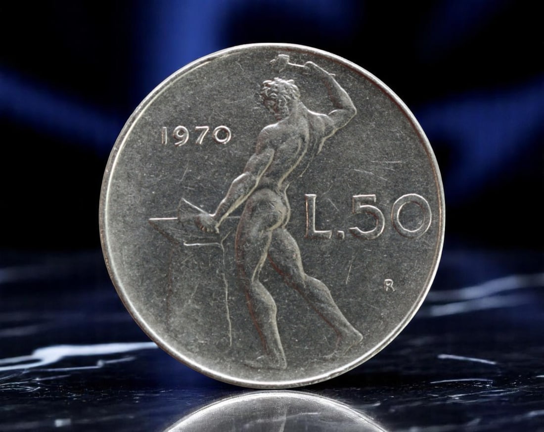 ITALY: Republic - L.50 Vulcan Standing Coin, 1970 R Rome Mint (25mm): Struck at the Rome Mint in 1970, this 50 Lire coin from the Italian Republic features a striking neoclassical composition emblematic of postwar Italian design. The obverse presents a stylized profile 