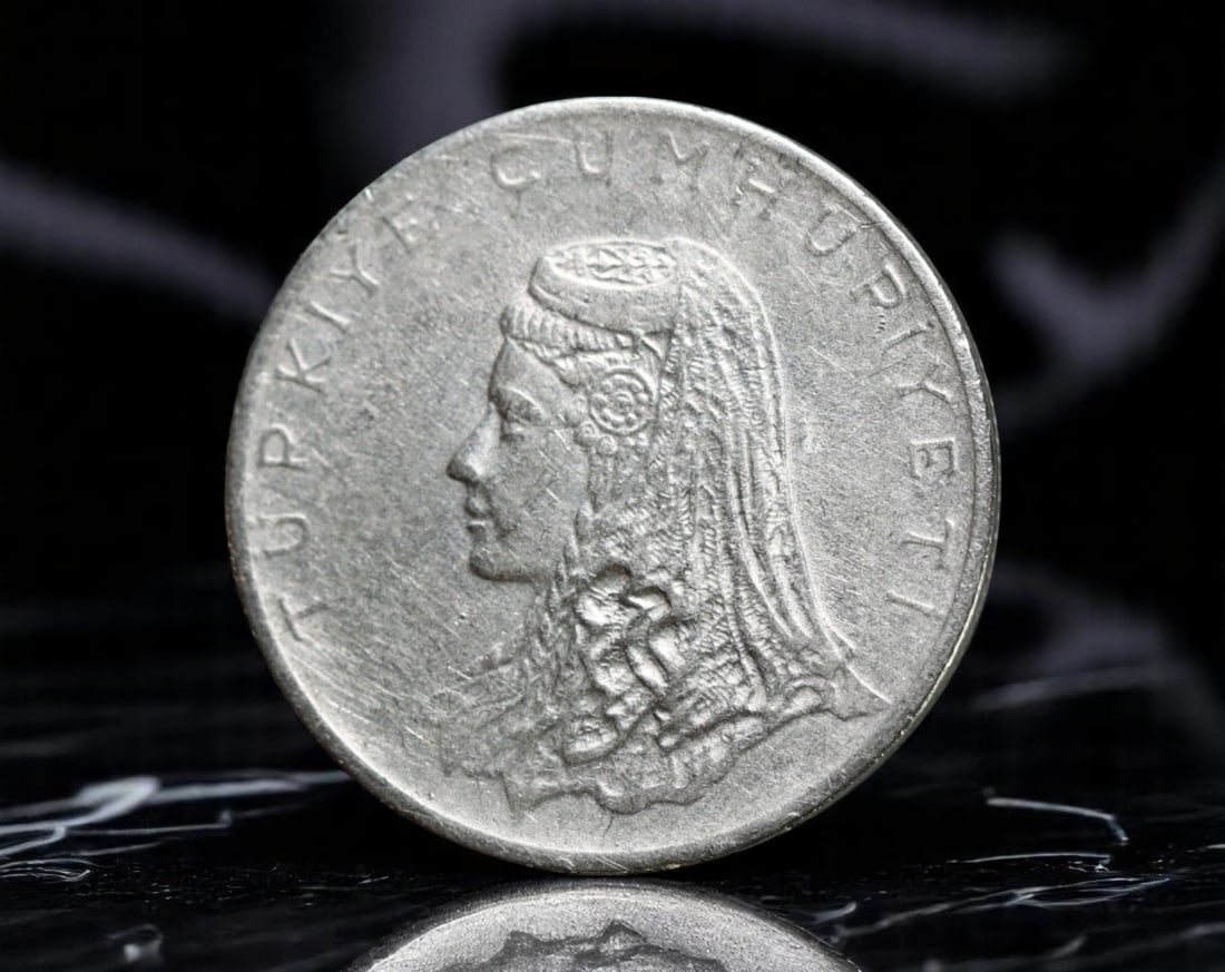 TURKEY: Republic - Anatolian Woman Motif 50 Kurus Coin, 1972 (25mm): Issued in 1972 by the Republic of Turkey, this 50 Kurus coin offers a powerful tribute to rural heritage and national identity. The obverse features a striking profile of an Anatolian woman wearing a 