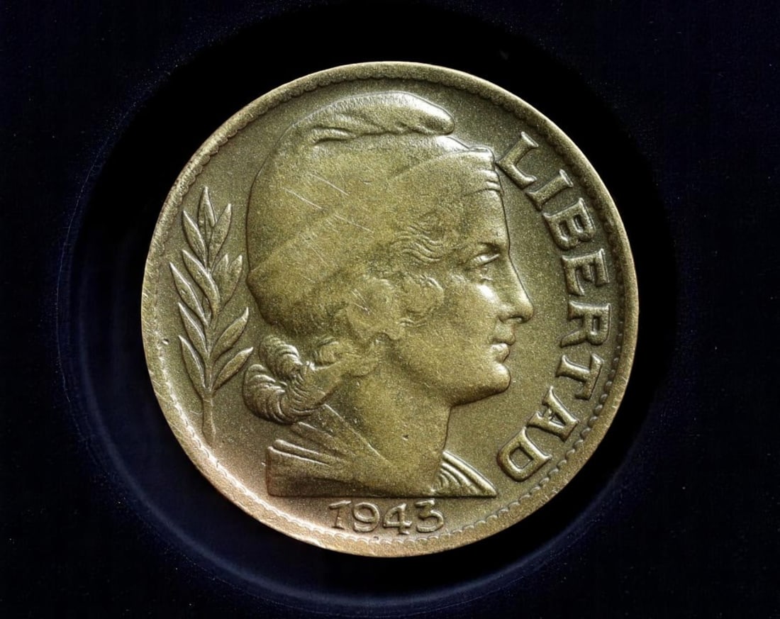 ARGENTINA: Agrarian Strength - Liberty & Livestock 20 Centavos Coin, 1943, 21mm: Issued at a time of intense economic nationalism in Argentina, this 1943 20 Centavos coin showcases the foundational ideals of the republic-agriculture, livestock, and liberty. The personification of 