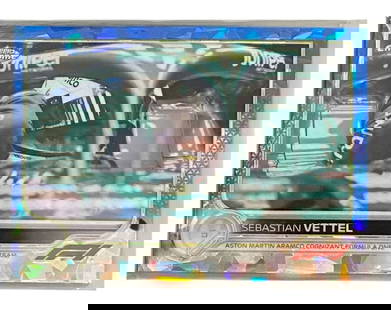 Topps Chrome F1 Card: Sebastian Vettel - Aston Martin Cockpit Close-Up, RayWave Refractor 2021 EN: This 2021 Topps Chrome Formula 1 RayWave Refractor features a focused cockpit shot of four-time World Champion Sebastian Vettel in his Aston Martin AMR21. Captured mid-session, the card showcases the