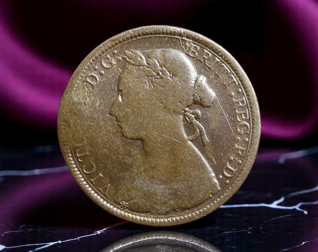 GREAT BRITAIN: Queen Victoria - Industrial Expansion Half Penny Coin, 1884, 25.5mm: Issued during the transformative reign of Queen Victoria, this 1884 Half Penny represents Britain's emergence as the preeminent industrial and imperial power of the 19th century. The obverse bears the
