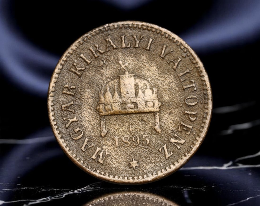 HUNGARY: Franz Joseph I - Crowned Authority 2 Filler Coin, 1895 KB Budapest Mint, 20mm: Issued during the dual monarchy of Austria-Hungary, this 1895 2 Filler coin exemplifies Hungary's autonomous identity within the imperial framework. Dominating the obverse is the sacred Crown of Saint