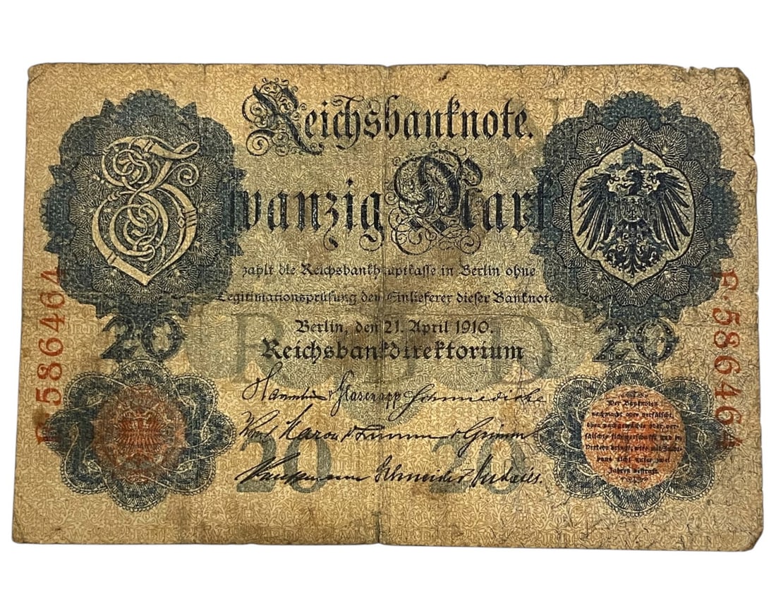 GERMANY/IMPERIAL ERA: Ornamental Authority - Reichsbanknote 20 Mark Banknote, 1910 Berlin, 14x9cm: Issued under the auspices of the German Empire, this 1910 Reichsbanknote of 20 Mark exemplifies prewar monetary prestige through baroque intricacy and symbolic gravitas. The front combines the Imperia