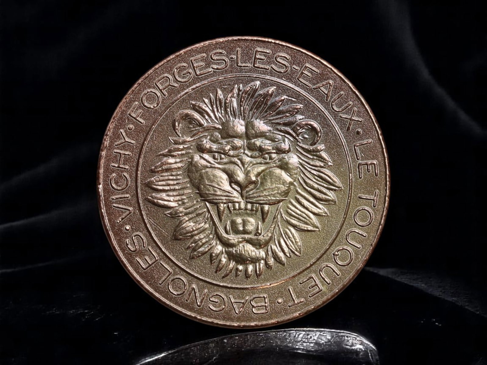 FRANCE: Groupe Partouche - Lion Emblem Casino Token 5 Francs, 27mm: A commanding casino token from the prestigious Groupe Partouche, celebrating its famed venues across France. The obverse showcases a fierce lion's head with a flowing mane, framed by the names of icon