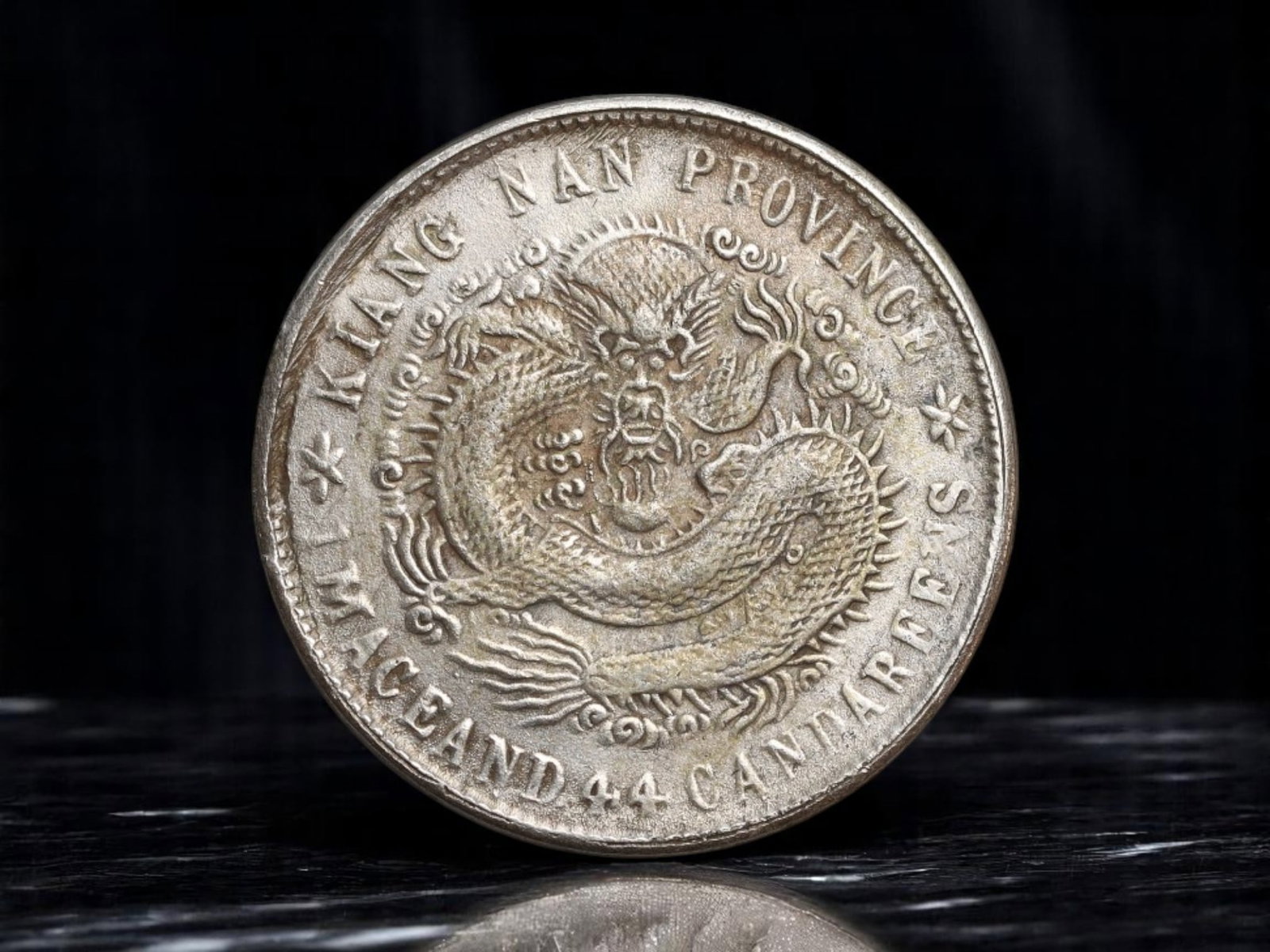 CHINA: Imperial Dragon 1 Mace and 4.4 Candareens Coin, circa early 20th century artistic issue, 23mm: This captivating coin draws inspiration from the grandeur of the Imperial Chinese dragon coinage, beautifully embodying the power and mystique of the Qing dynasty era. The central motif presents an in