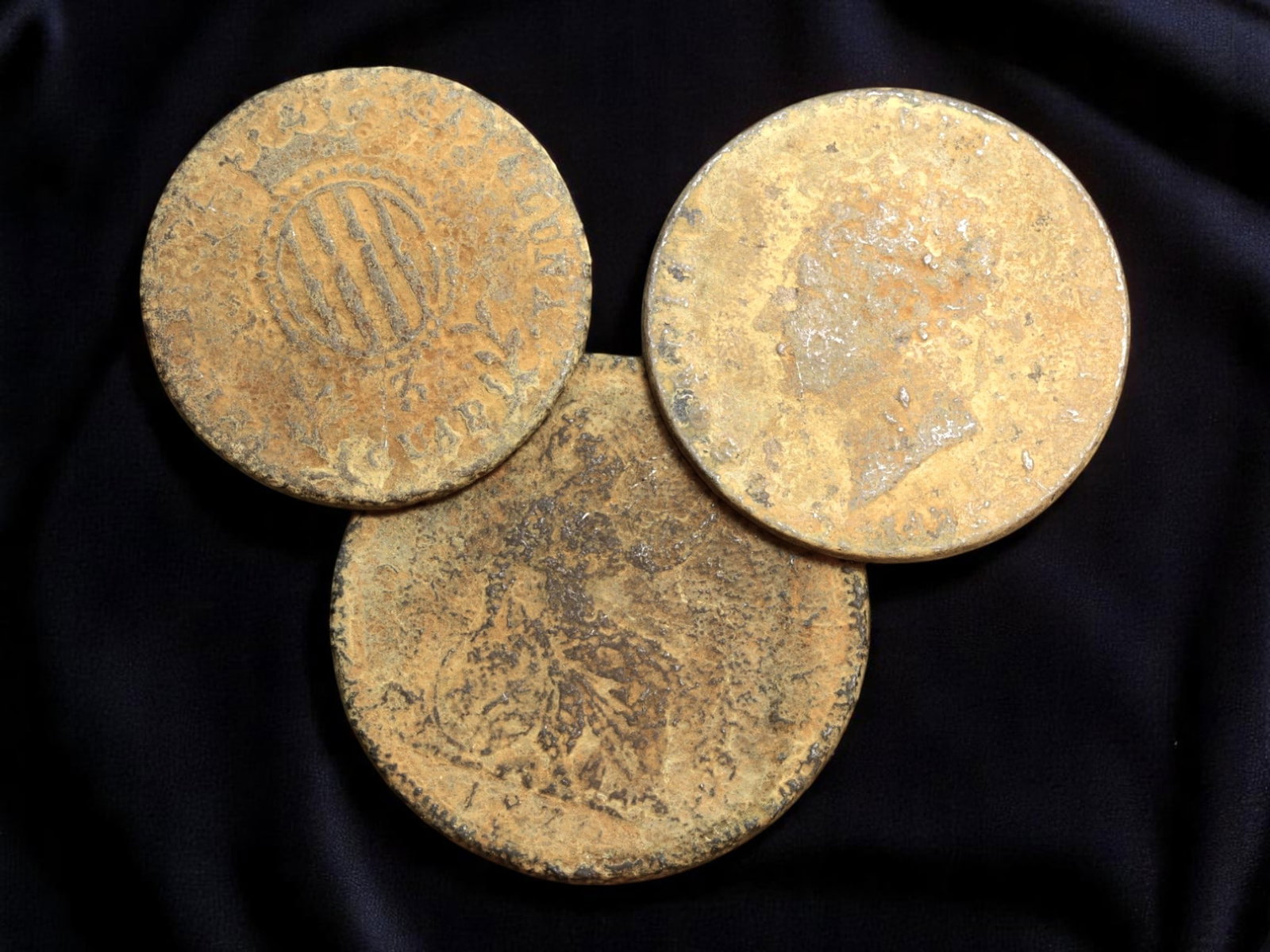 UNITED KINGDOM & SPAIN: Monarchy in Transition - George IV, Victoria, and Isabella II Coins, 25-30mm: This trio of copper coins brings together the regal iconography of two enduring monarchies-Britain and Spain-during periods of profound national and global transformation. From Britain, the well-worn 