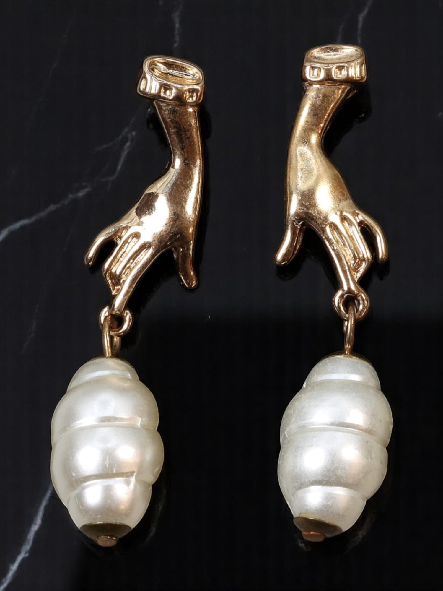 VINTAGE SURREALIST STYLE: Drop Earrings - Hand Motif with Pearl-Like Drops 5x1.1cm: A whimsical estate pair blending surrealist fantasy with vintage charm, these earrings feature sculptural hand motifs in goldtone, gracefully grasping large, spiral pearl-like drops. The textured deta