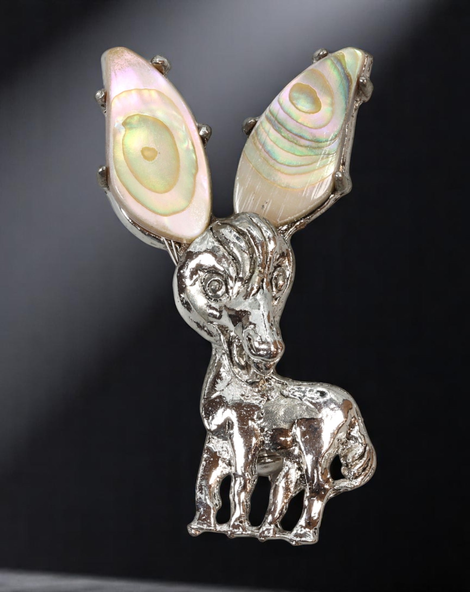 ARTISTIC MODERN STYLE: Deer Brooch - Abstract Form with Shell Inlay Antlers, Silvertone (5x2.8cm): This striking brooch transforms animal iconography into playful abstraction with a stylized deer figure rendered in polished silvertone. The antlers are uniquely formed from iridescent shell slices, t