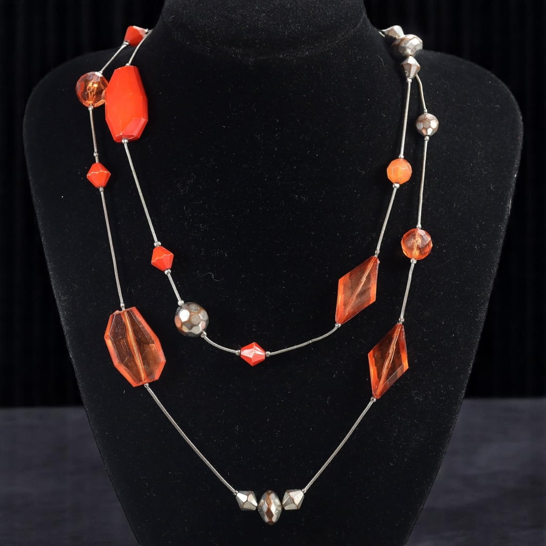 MID-CENTURY ESTATE: Double Strand Necklace - Faceted Beads, Geometric Shapes, 100cm: A vibrant addition from an estate jewelry collection, this mid-century inspired double strand necklace features a striking composition of faceted and smooth bead-like elements in fiery orange and ambe