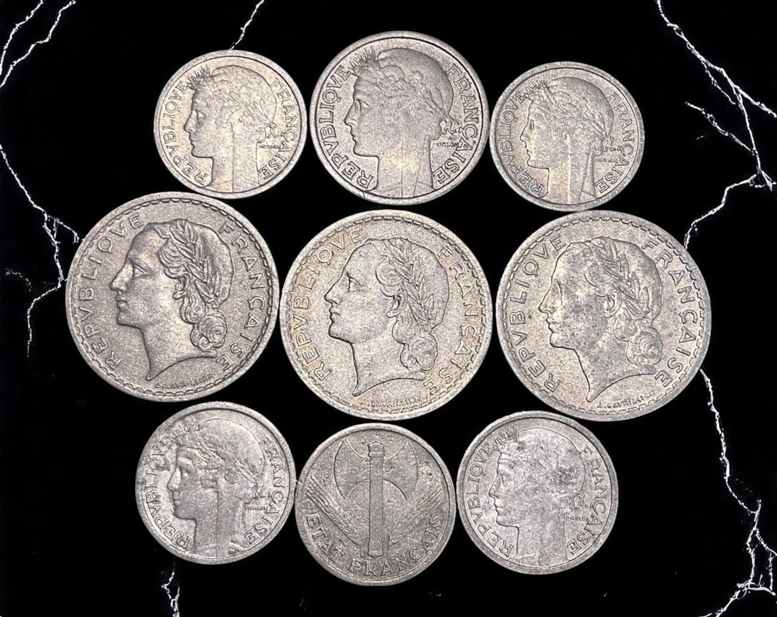 FRANCE: Republic Resilient - Wartime and Postwar Franc Coin Series, 1941-1953 (9pcs), 23-31mm: This evocative 9-coin assemblage charts the turbulent trajectory of France from occupation to rebirth. Struck between 1941 and 1953, these pieces reflect shifting regimes and ideologies-from the warti