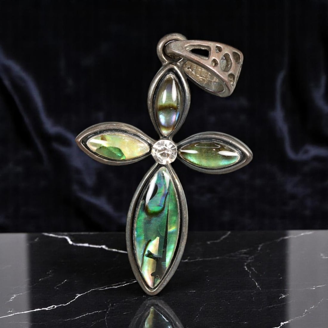 Pendant - Cross Motif with Abalone-Effect Inlays and Clear Center Stone, 3.5 x 2.5 cm: This distinctive vintage-modern pendant presents a sculptural cross motif formed by elongated marquise-shaped abalone-effect cabochons, radiating iridescent green, blue, and violet tones. A luminous r