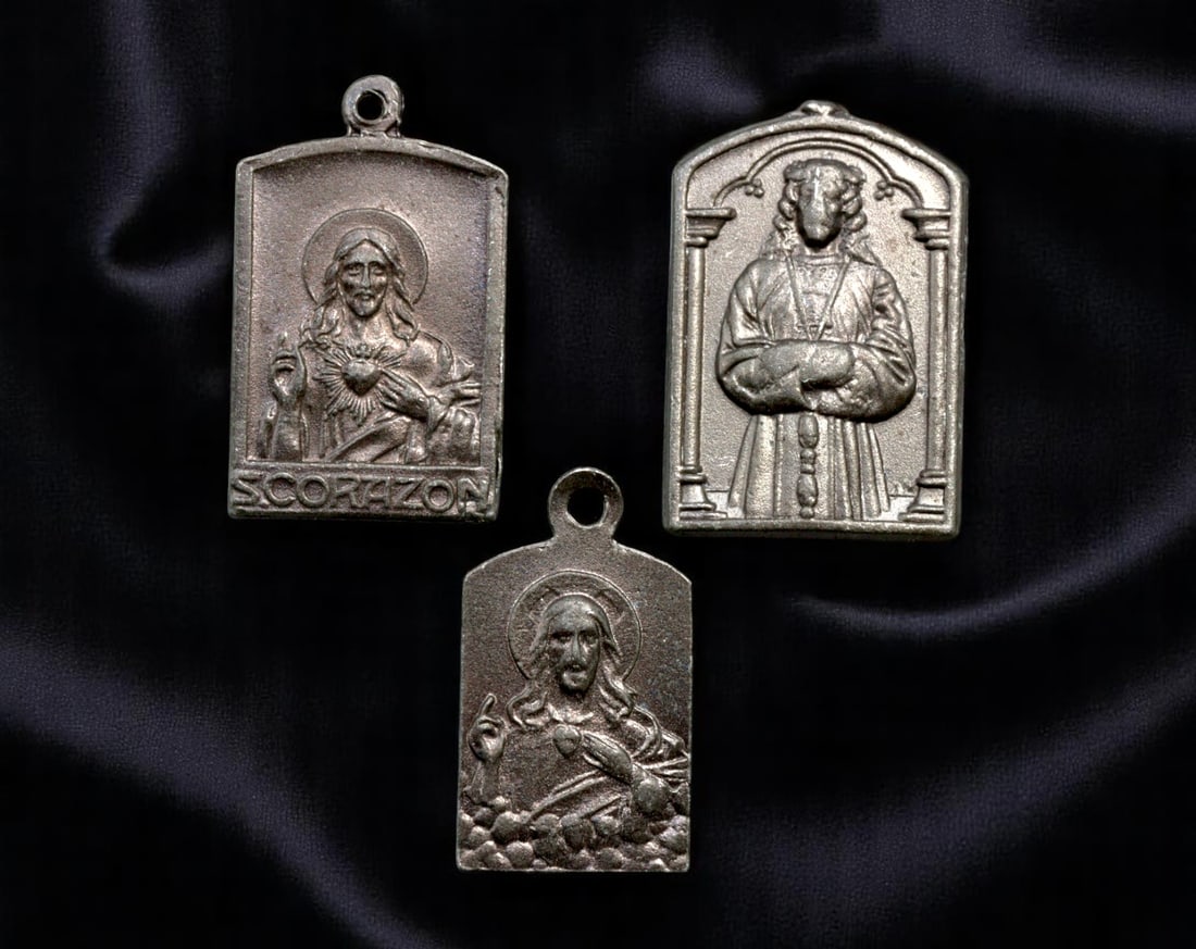 SPAIN: Sacred Heart & Capuchin Devotion - Rectangular Religious Medallions, c.1920-1940, 21-24mm: This harmonized set of three Spanish rectangular medallions reflects the interplay between personal piety, regional Marian cults, and institutional religious orders. Cast in durable base alloy, they e