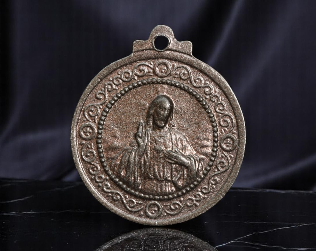 SPAIN: Marian Devotion - Sacred Heart & Our Lady of the Forsaken Medal Coin, ND, 23mm: This round devotional medal beautifully unites two sacred images central to Spanish Catholic spirituality. One side depicts the Sacred Heart of Jesus, radiating divine compassion and intimate mercy, f
