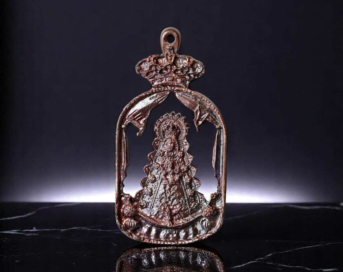 SPAIN: Pilgrimage Devotion - Virgen del Rocio Processional Cutout Medal, ca. 20th Century, 87mm: This striking openwork devotional medal pays homage to La Virgen del Rocio, the deeply venerated Marian icon of southern Spain. Cast in a pierced silhouette form with high-relief detailing, the crowne
