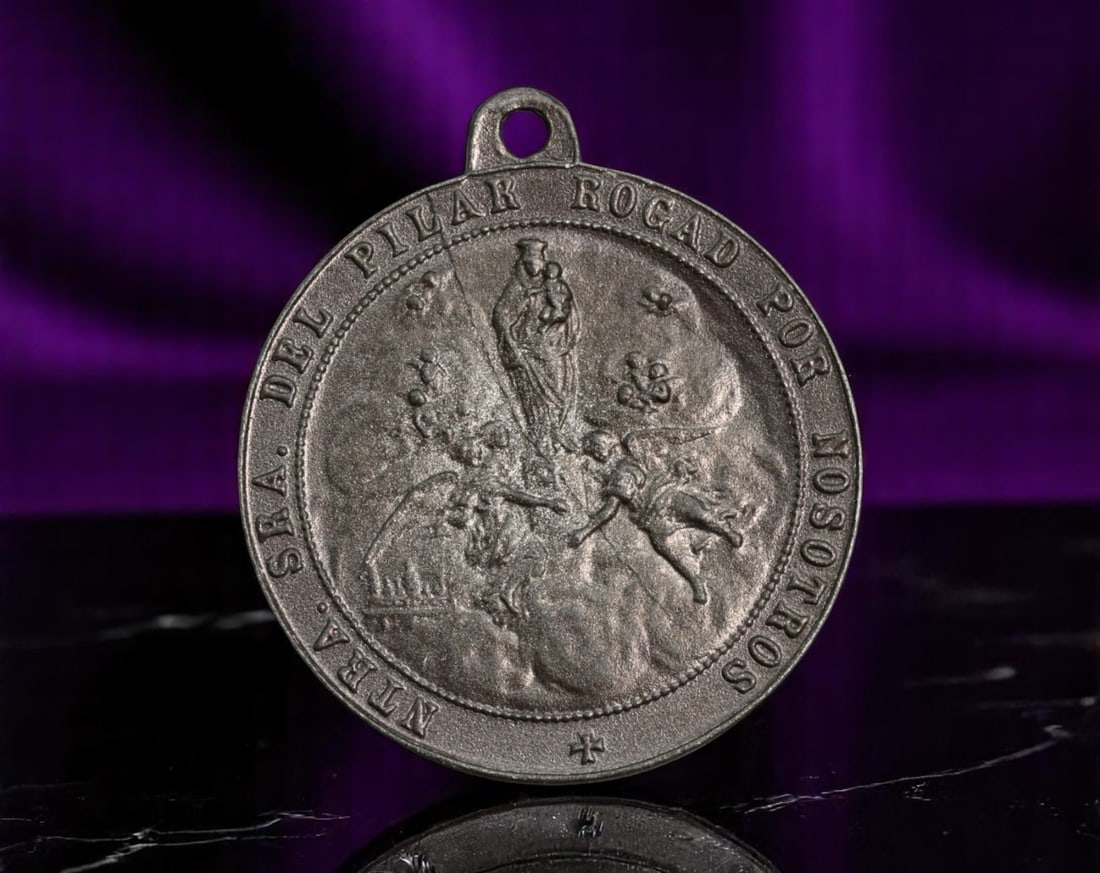 SPAIN: Marian Devotion - Medal of Our Lady of the Pillar and Crucifixion, 28mm: Infused with deep regional and religious identity, this devotional medal honors Nuestra Senora del Pilar, the revered Marian apparition of Zaragoza, paired poignantly with a stark image of the Crucifi