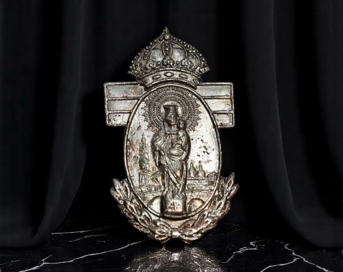 SPAIN: Virgin of the Pillar - Royal Devotion Brooch Medal, ca. Early 20th Century, 30mm: Encapsulating centuries of Spanish religious identity, this regal brooch medal depicts the Virgin of the Pillar (Virgen del Pilar), crowned and radiant, standing atop the traditional pillar with the C