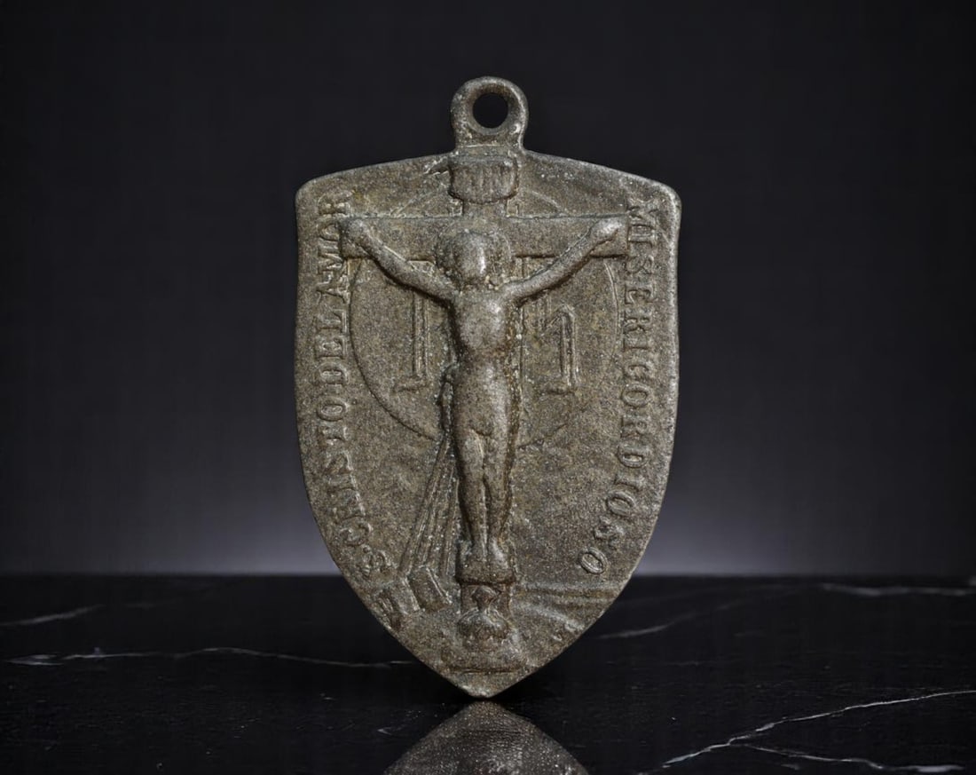 SPAIN: Marian Devotion - Misericordioso & Maria Mediadora Religious Medal, Early 20th Century, 32mm: This poignant devotional medal, cast in the shape of a heraldic shield, embodies the intimate relationship between personal faith and divine intercession in early 20th-century Spanish Catholicism. One