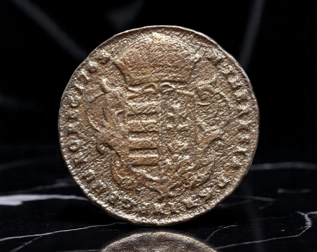 HUNGARY/HABSBURG: Maria Theresia - Patroness of Hungary 1/2 Denar Coin, 1768, 22mm: Issued under the reign of Empress Maria Theresia, this 1768 half denar coin embodies a moment of sacred monarchy and dynastic cohesion in Central Europe. The crowned Madonna and Child, radiating divin