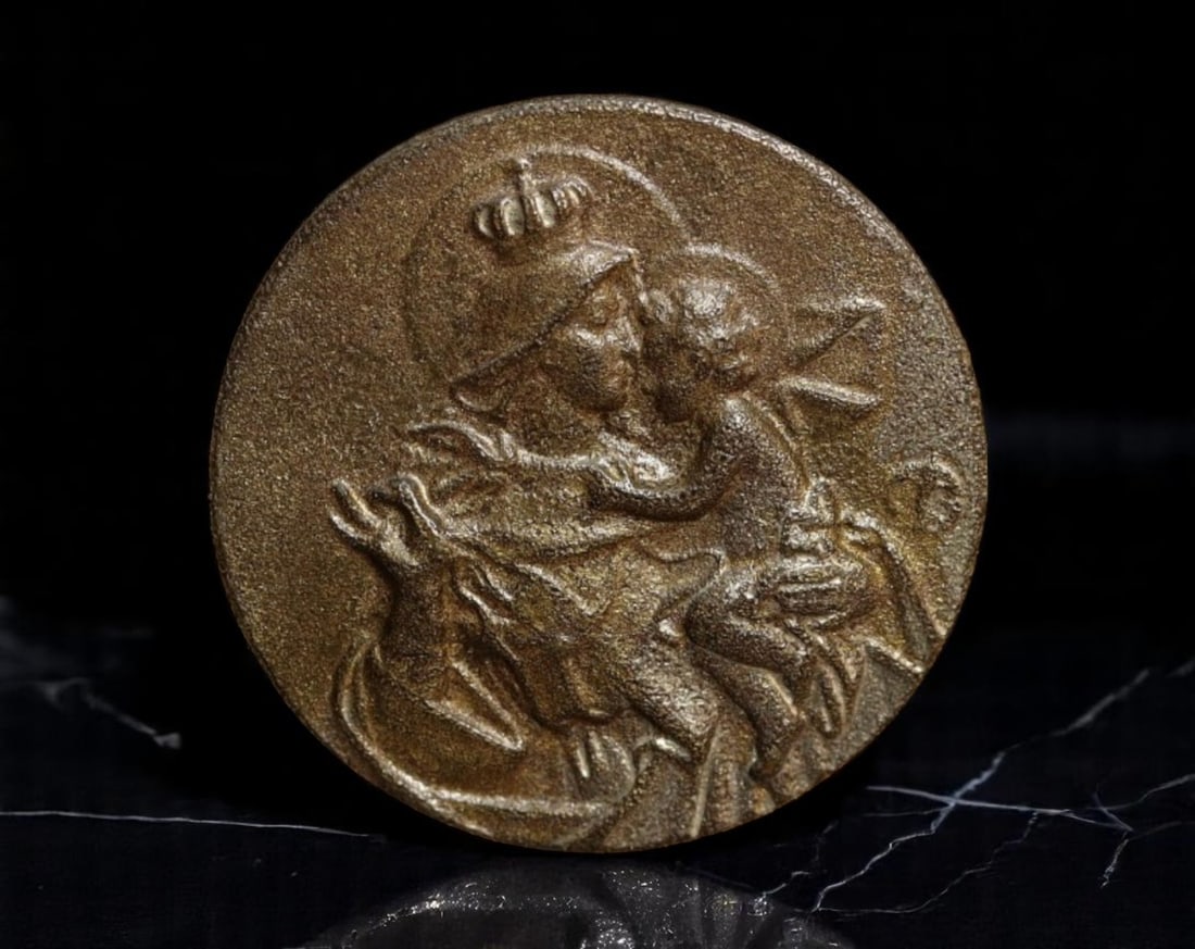 ITALY: Madonna and Child - Crowned Devotional Pin Medal, ca. Early 20th Century, 16mm: This understated bronze-toned devotional pin medal captures the intimate tenderness between the Virgin Mary and the Christ Child-rendered in a sculptural style deeply rooted in early 20th-century Ital