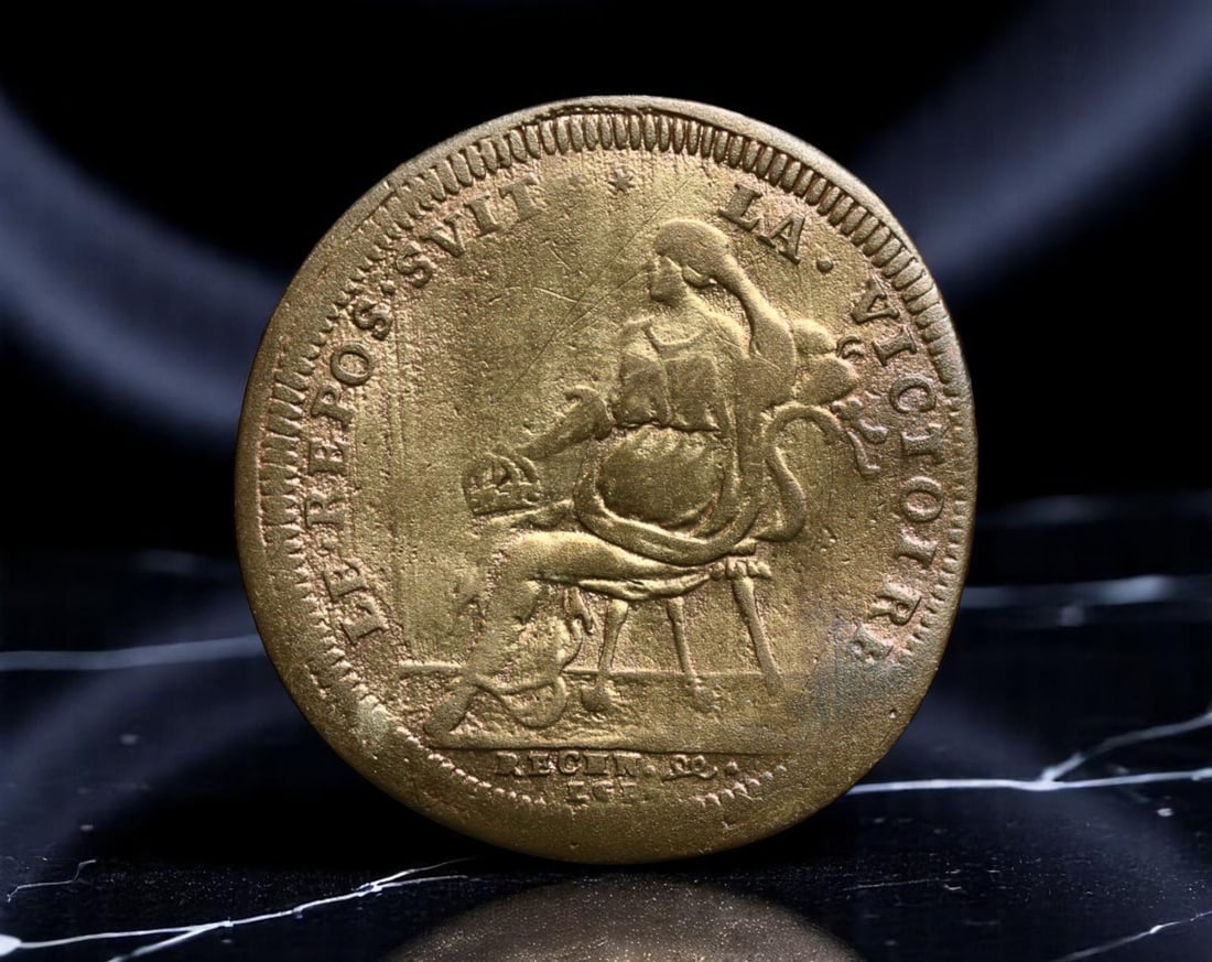 FRANCE: Louis XIV - Triumph of the Sun King Bronze Jeton, c. Late 17th Century, 22mm: Emanating the grandeur of absolutism, this bronze jeton honors Louis XIV, the famed "Sun King," and France's cultural zenith in the late 17th century. The obverse bears a robust and idealized bust of 