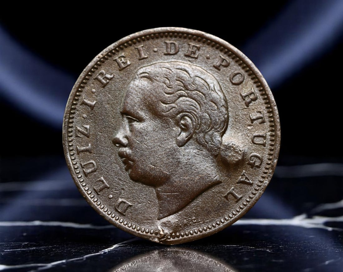 PORTUGAL: King Luis I - Maritime Renaissance XX Reis Coin, 1882, 30mm: Struck in the twilight of Portugal's imperial influence, this 1882 XX Reis coin under King Luis I embodies a monarch who championed naval modernization and scientific advancement. The portrait of King