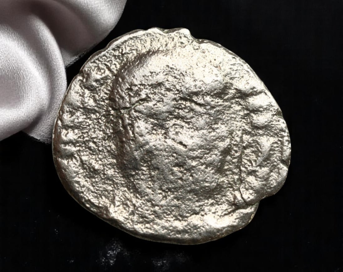 ROMAN EMPIRE: Ancient AE Coin Bronze Issue, 17mm: Issued during one of the most transformative epochs of the Roman Empire, this bronze coin embodies the endurance and adaptability of Roman statecraft across centuries. Its compact flan and timeworn su