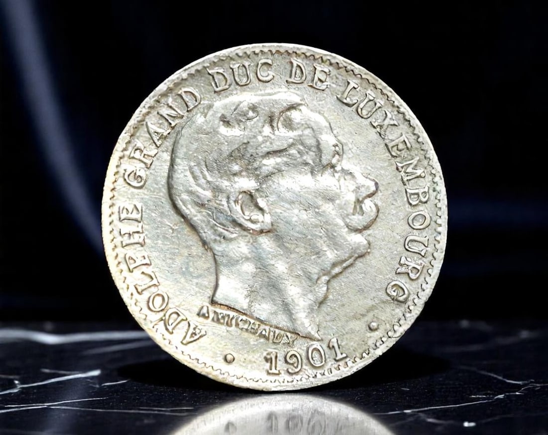 LUXEMBOURG: Adolphe - Constitutional Monarchy 5 Centimes Coin, 1901, 17mm: This charming 5 Centimes coin issued under Grand Duke Adolphe in 1901 captures a formative period in Luxembourg's national evolution. The obverse presents a dignified portrait of Adolphe, the first Na